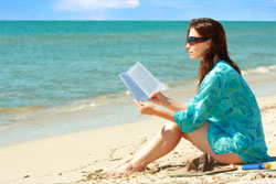 Woman Reading on the Beach