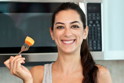 Female Cooking With Microwave
