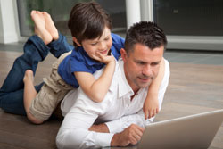 Father and Son Working on Laptop