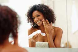 Women Applying Skin Cream