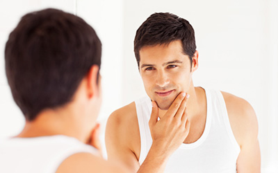 Confident Student Looking in Mirror