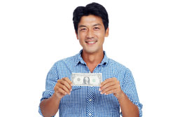 Male Holding Dollar Bill