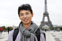 Male Standing In Front of Eiffel Tower