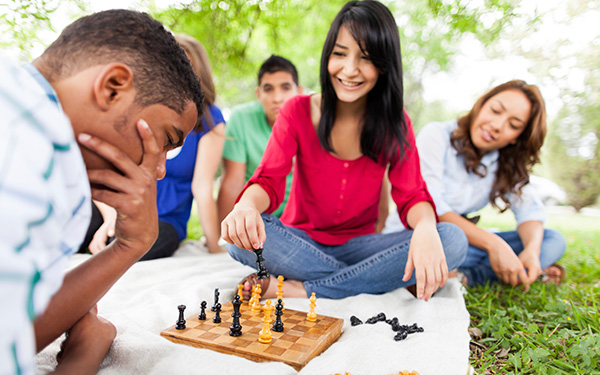 Students Outdoors Playing Chess