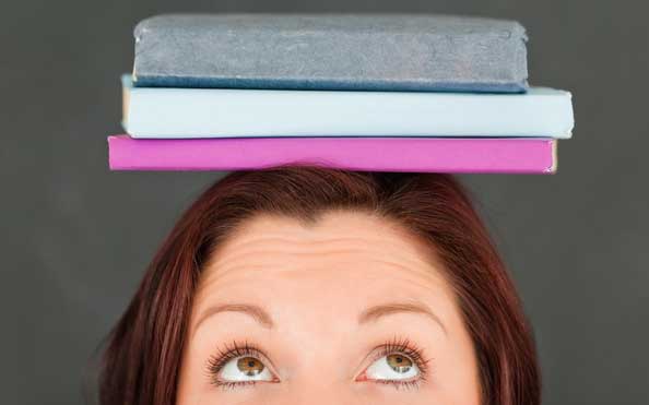 Female with Books Balanced on Head